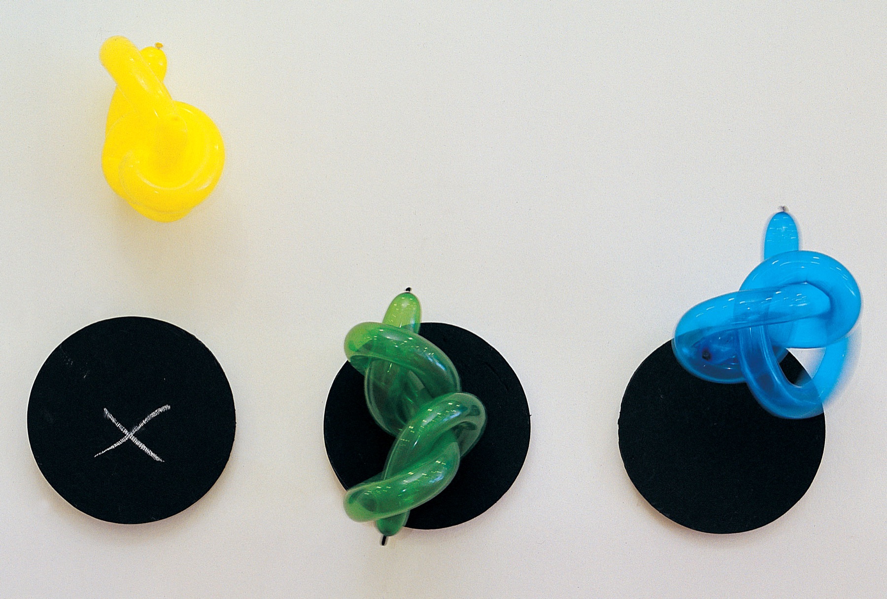 Balloon studies arranged over black circles