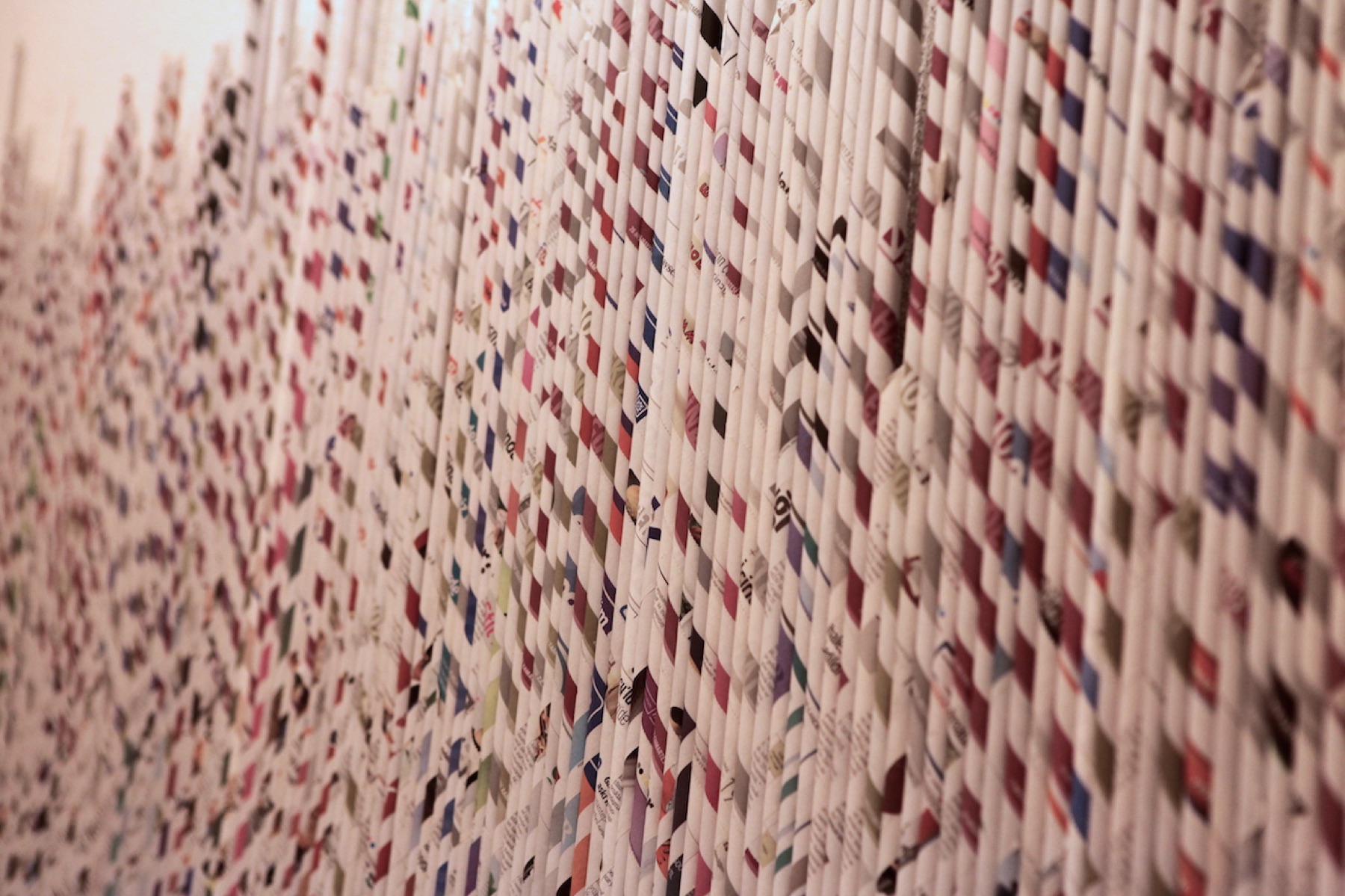 Woven rolled-paper wall installation